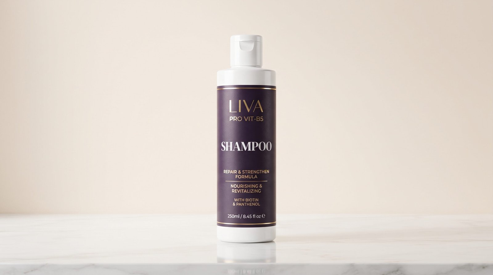 LIVA SPF 50+ Sunblock white tube with gold cap on a minimalist light beige stone background